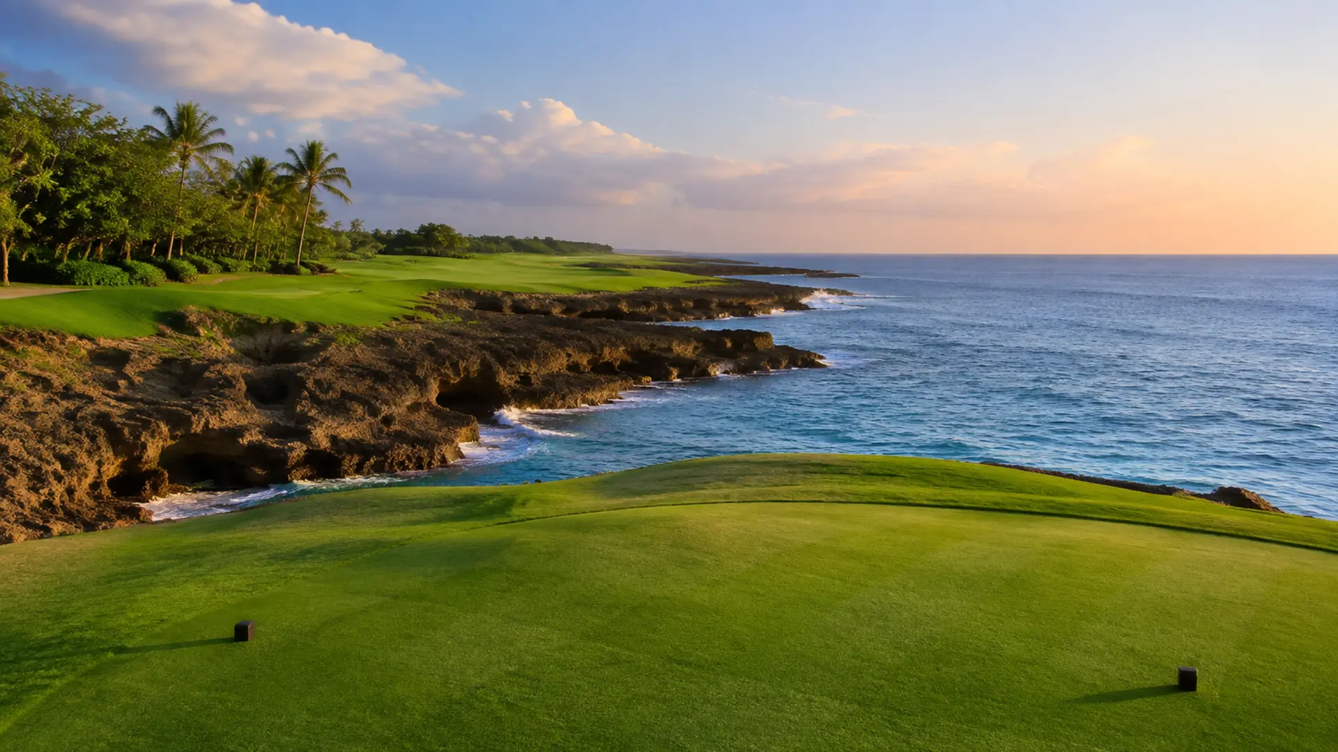 A clifftop golf fairway above the sea at Casa de Campo in late afternoon light