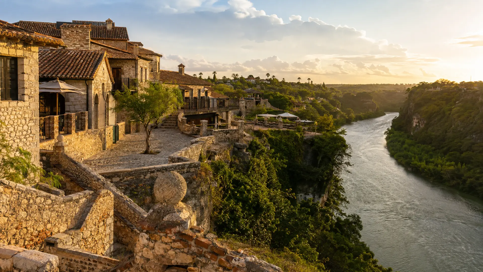 Stone buildings and cobbled walkways of Altos de Chavón above the Chavón river near La Romana at sunset