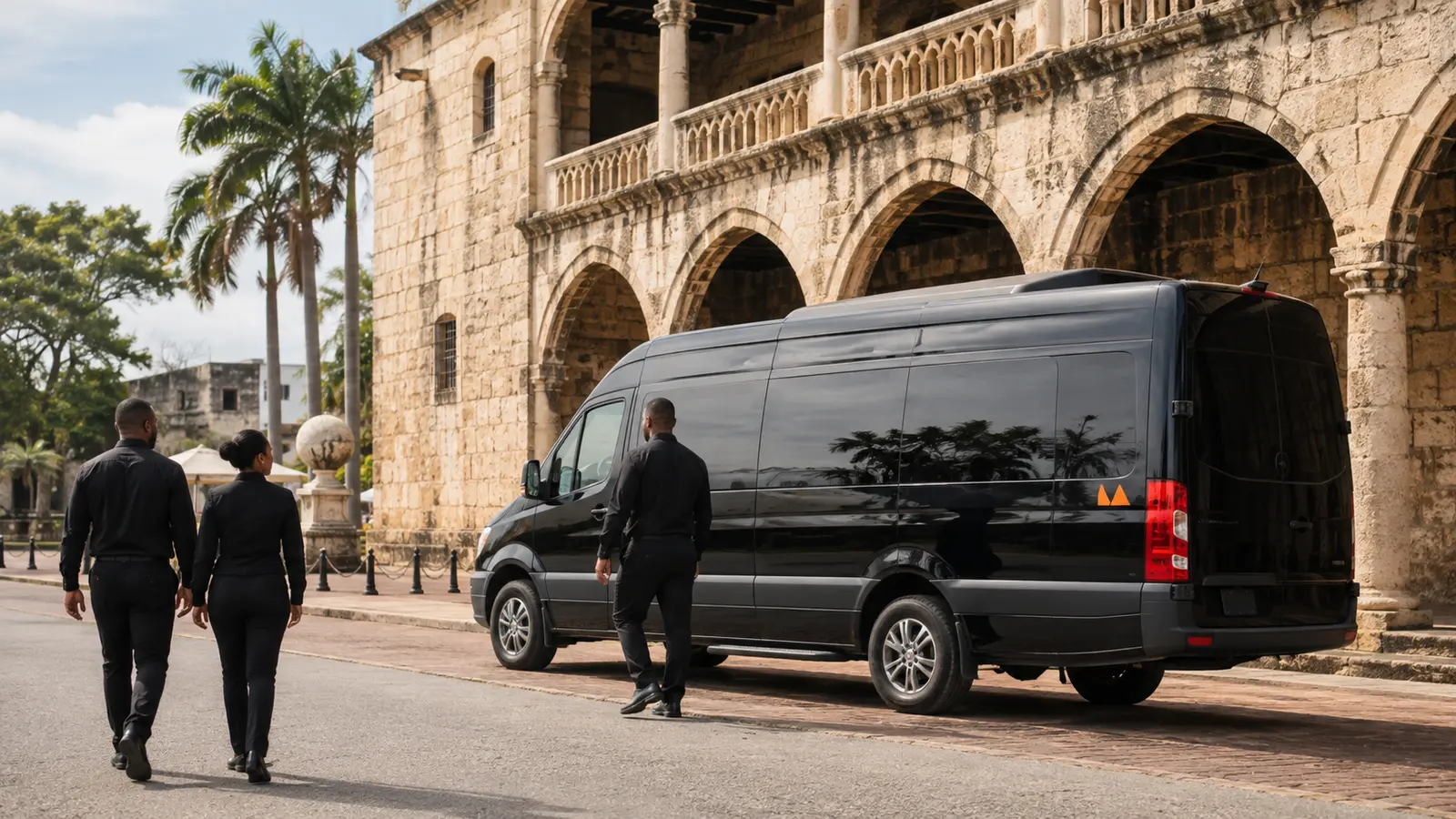 A black Mercedes Sprinter van parked on a colonial street in Santo Domingo while a group boards