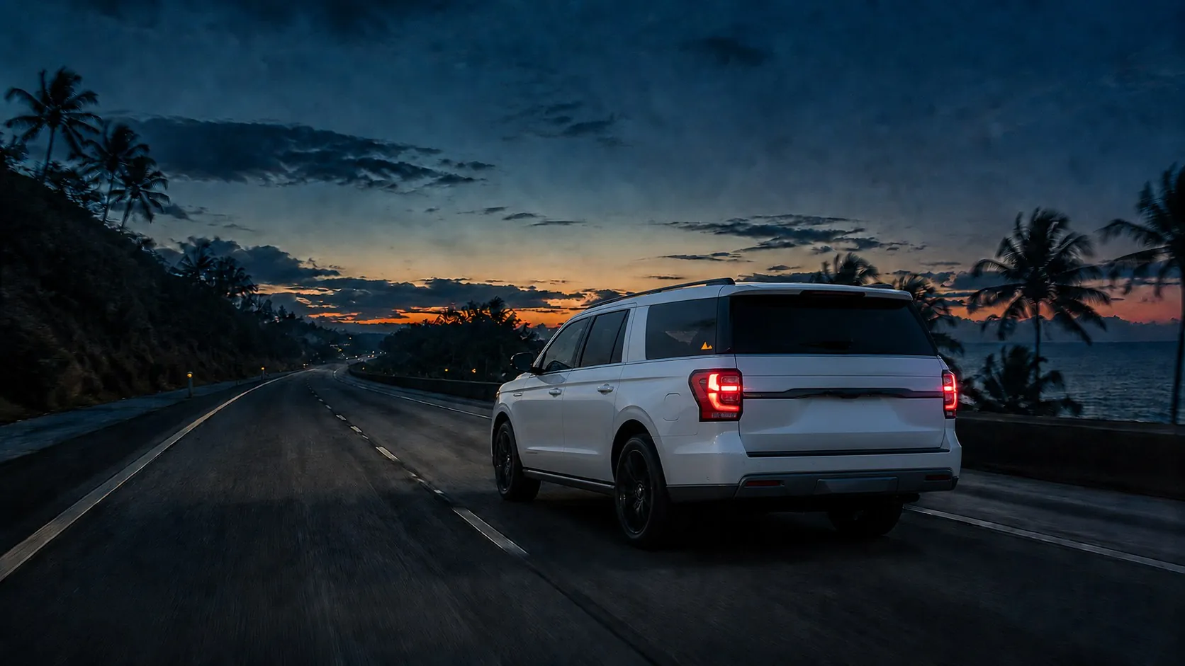 White SUV driving a coastal Dominican highway at dusk